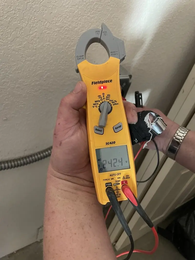 Voltage testing with clamp meter during Generator Installation in Clarksville